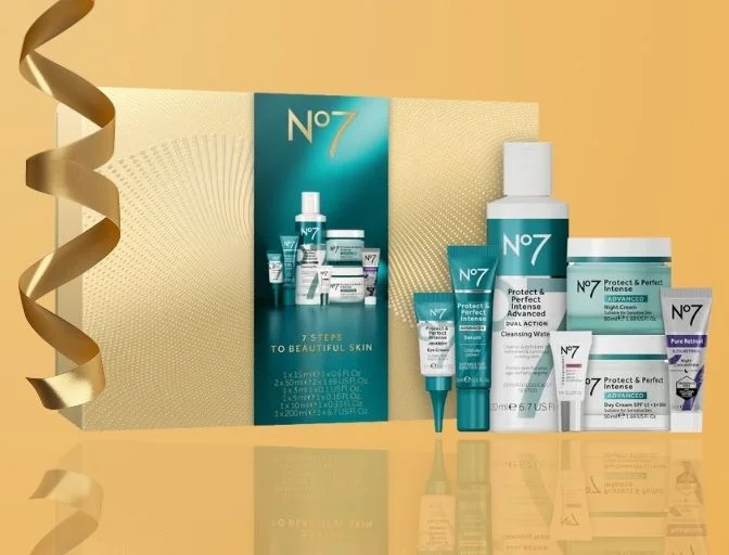 Image features the No7 7 STEPS TO BEAUTIFUL SKIN GIFT SET on a gold background