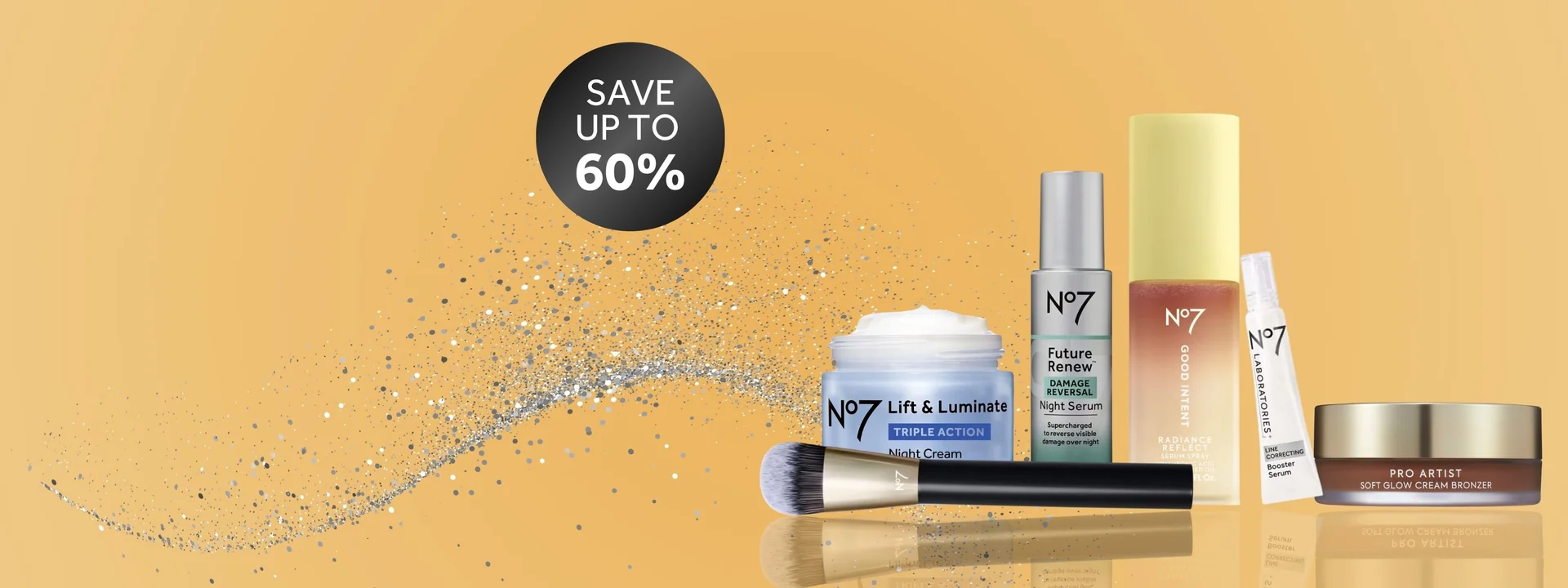 Image features No7 products on a gold background. Text "save up to 60%" is displayed on a black roundel. There is a stream of silver glitter behind the products. The products have a reflection for a premium feel.