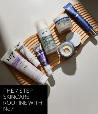 THE 7 STEP SKINCARE ROUTINE WITH No7 text over image of various No7 skincare products on a wooden bathroom tray on a white flat lay background.