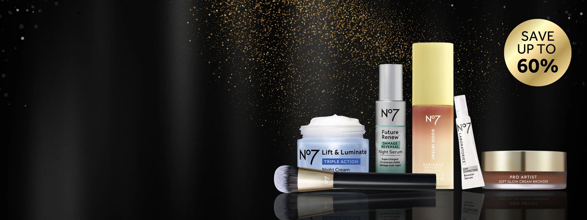 Image features No7 products on a black background. Text "save up to 60%" is displayed on a gold roundel. There is a spray of gold glitter behind the products. The products have a reflection for a premium feel.